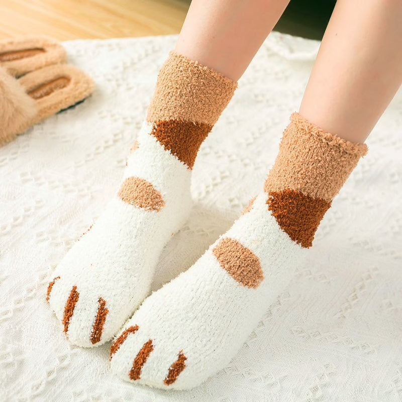 A pair of lovely, warm socks to match your footsies to your little furry friend's paws.  Soft and very comfy.  One size ginger tabby cat