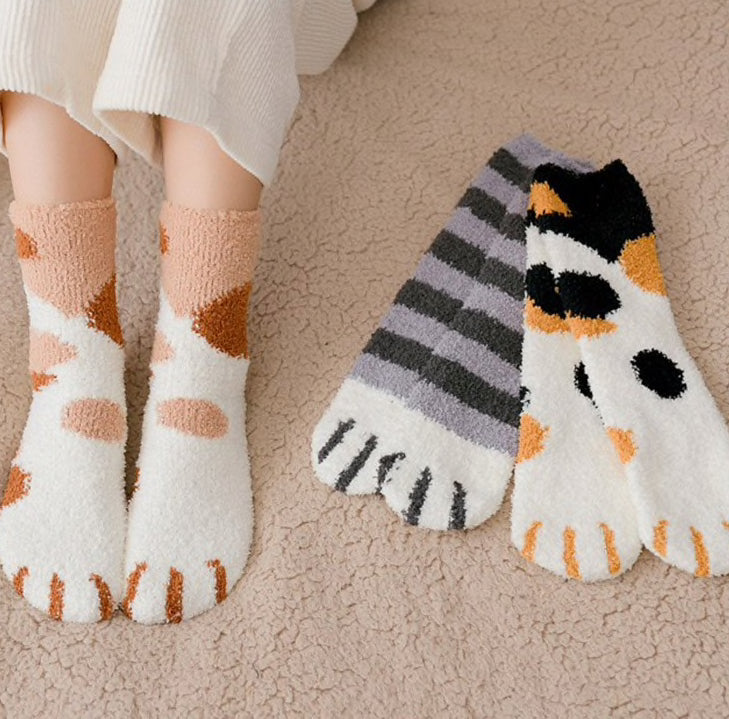 A pair of lovely, warm socks to match your footsies to your little furry friend's paws.  Soft and very comfy.  One size grey ginger calico patterns