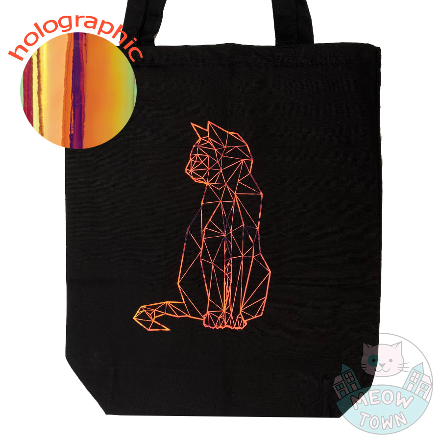 Meow Town Special, designed and printed in the UK by our team exclusively for You. Stylish geometric kitty design with holographic vinyl print. 100% cotton heavy duty black canvas tote bag.