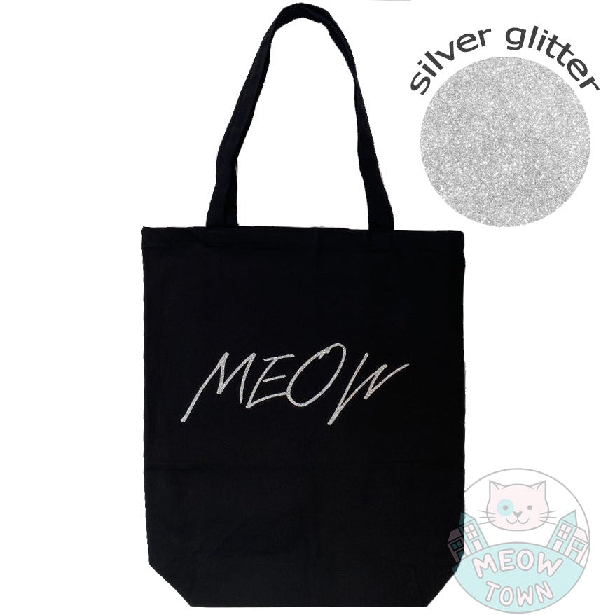 Meow Town Special, designed and printed in the UK by our team exclusively for you. Cute 'Meow' slogan with silver colour glitter print. 100% cotton heavy duty black canvas tote bag. Durable single layer material, large capacity.
